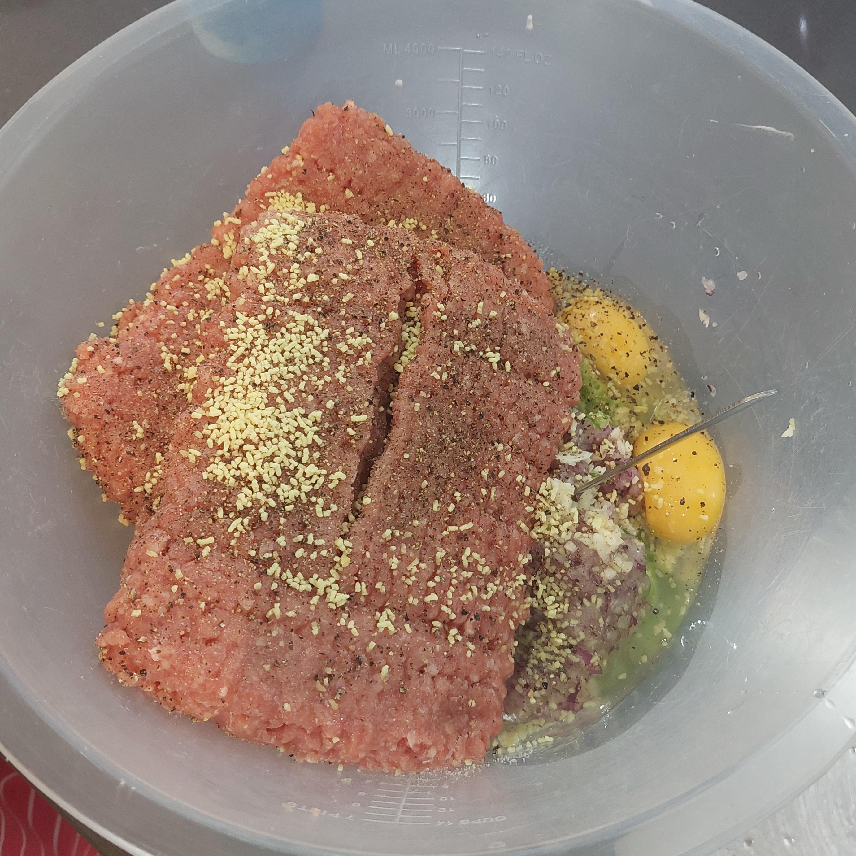 In a bowl add ground meat (turkey/beef), egg, bread crumbs, salt, pepper, diced onion, diced garlic, diced spring onion and MSG. Mix until combined.