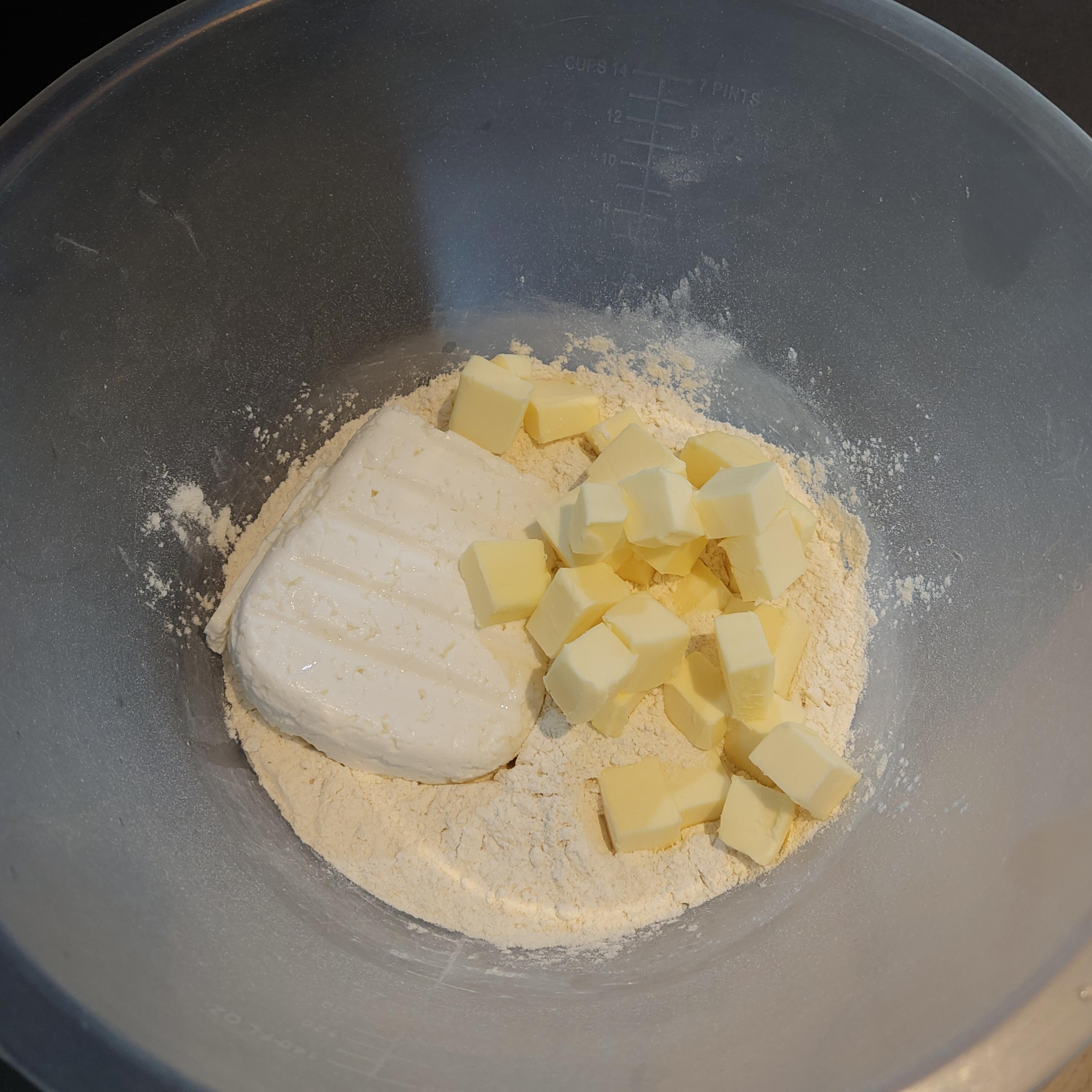 Put flour, butter and curd cheese together into mixing bowl.