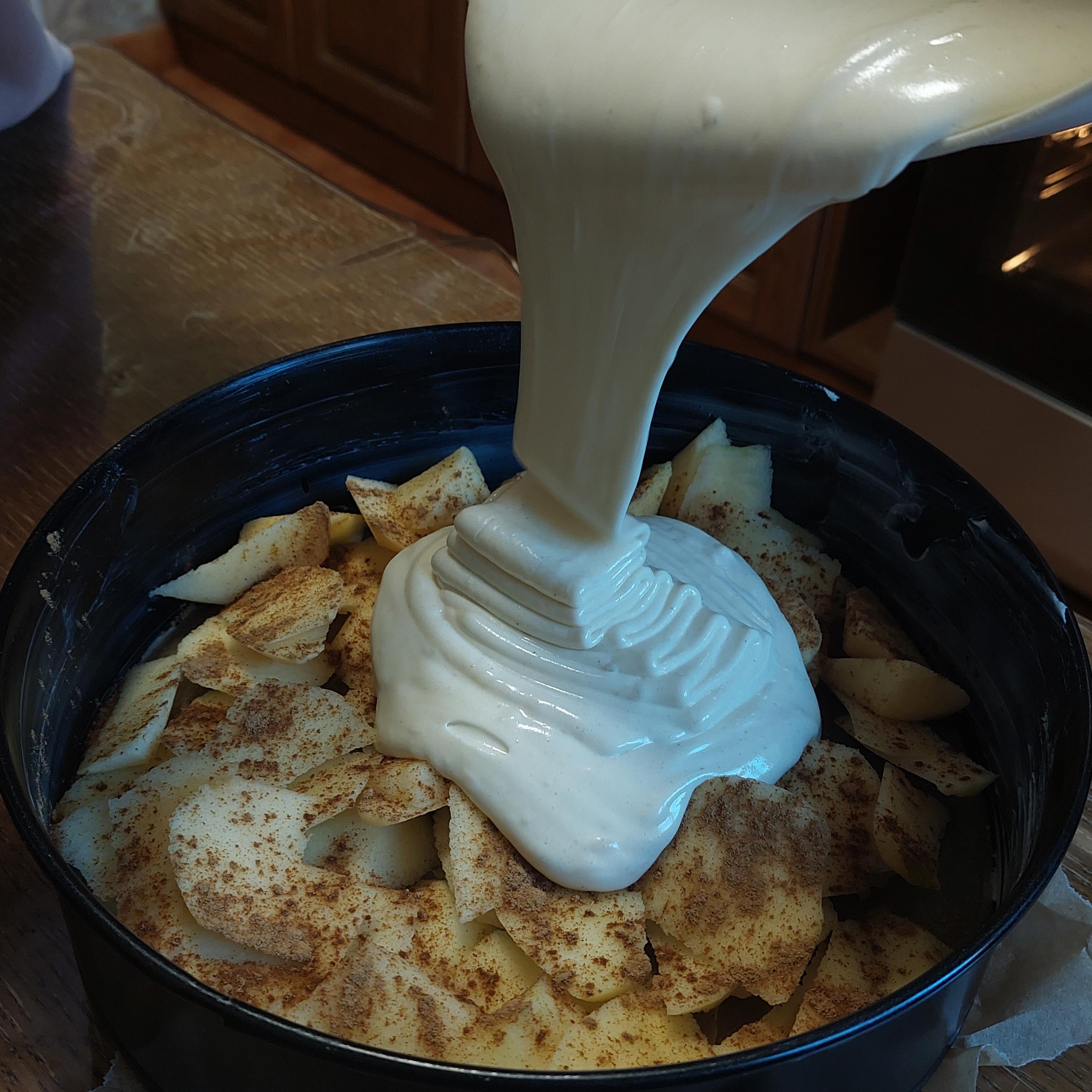 Pour the mixture into the tray over apples.
